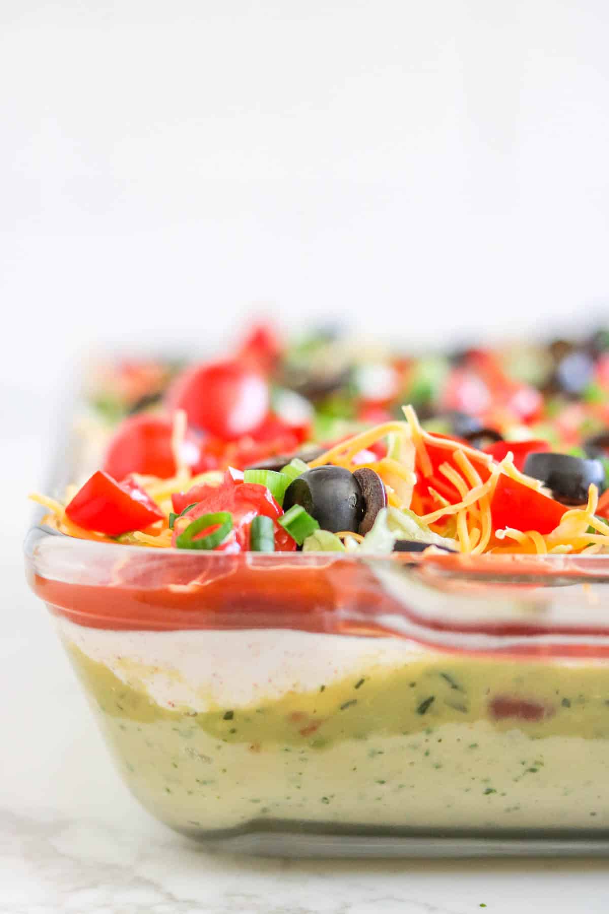 Layered Taco Dip with White Beans- a perfect tailgate appetizer