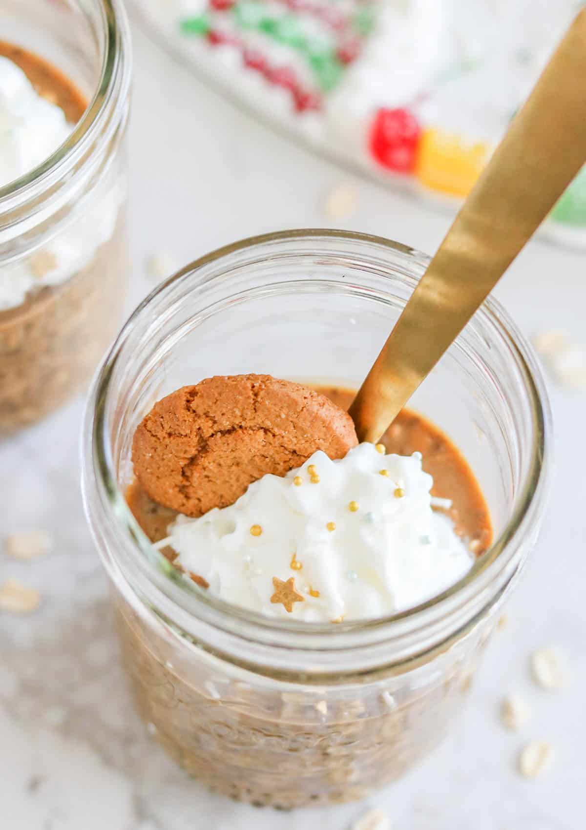 gingerbread overnight oats whip cream and gingersnap on top