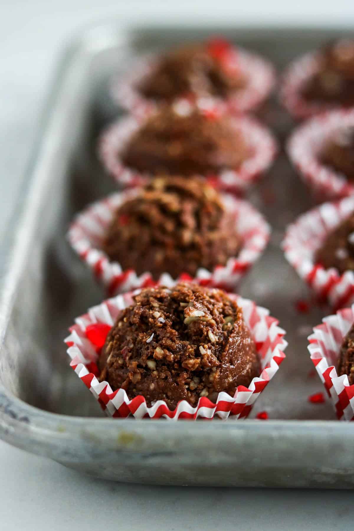 Candy Cane Cocoa Powerballs on a cookie sheet 