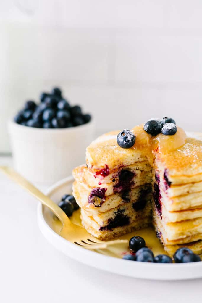 Gluten-Free Lemon Blueberry Buttermilk Pancakes fluffy short stack with center cut 