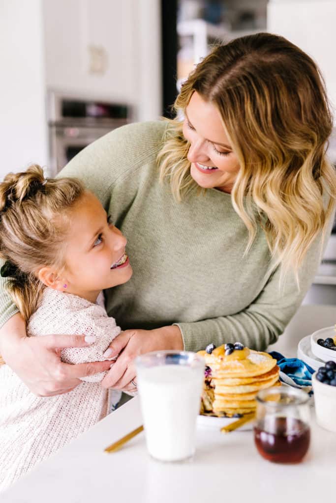 Gluten-Free Lemon Blueberry Buttermilk Pancakes sharing a hug with my mini sous chef