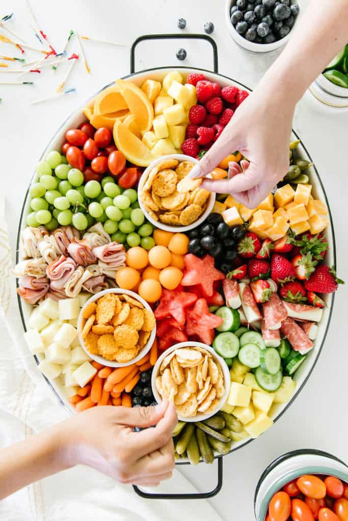 Kid-friendly Summer Snack Platter hands digging in