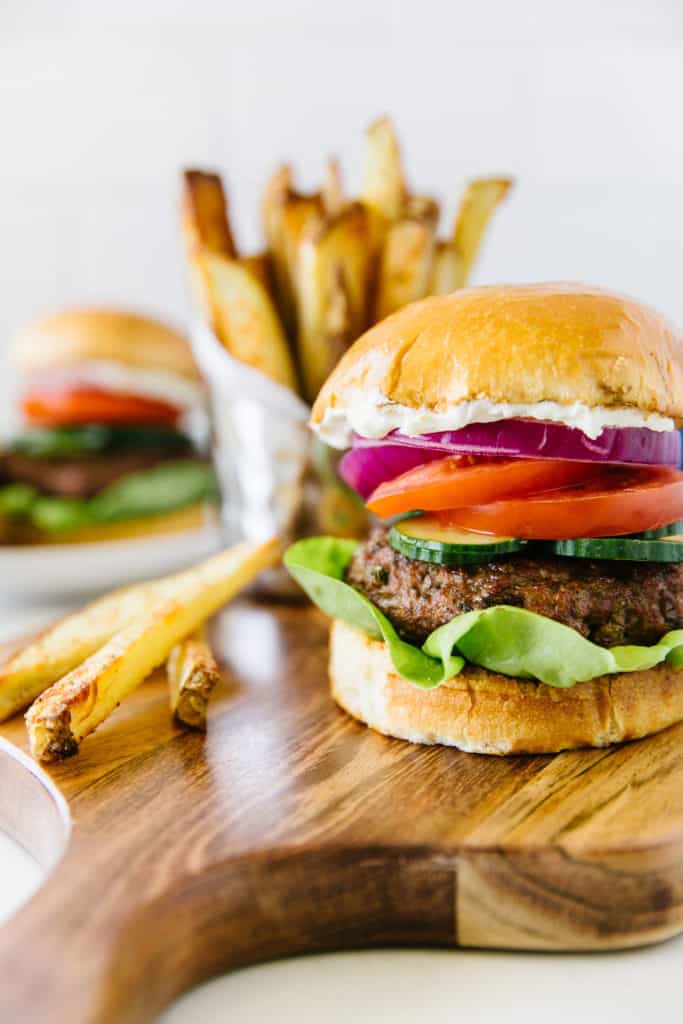 Mediterranean Lamb Burger plated with steak fries 