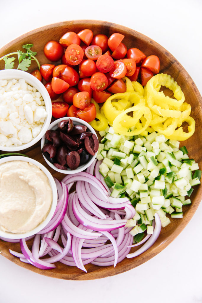 Grilled Pita Pizza toppings on a platter 