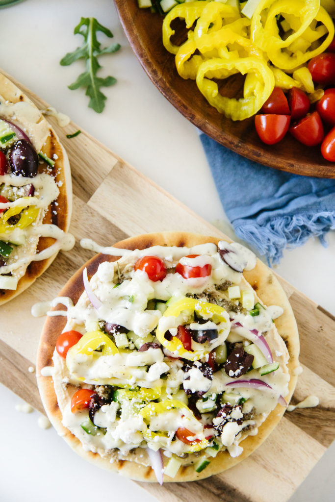 Grilled Pita Pizzas on a wooden serving tray